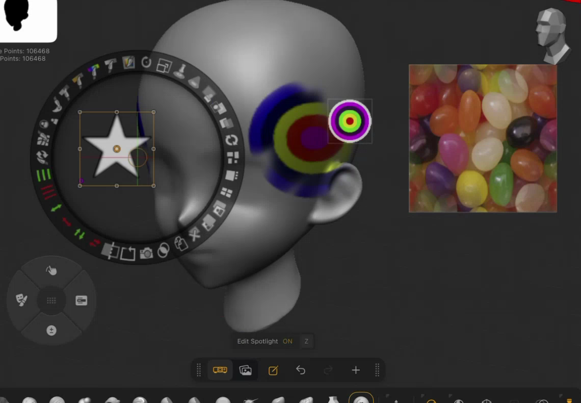 Spotlight with three images: one (the bull’s-eye target) already projected onto the model as Polypaint, one (the star) selected in the dial, one (the jelly beans) floating as reference
